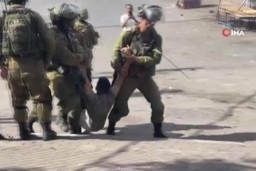İsrail askerleri, Filistinli genci yerde sürükleyerek gözaltına aldı